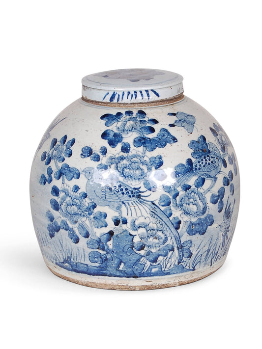 Porcelain Chinoiserie jar with blue and white bird and flower design.