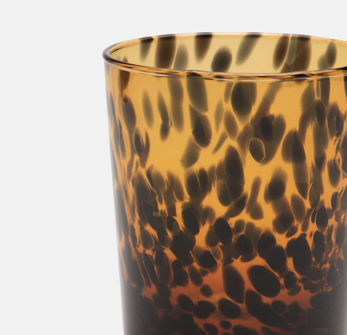 hand-blown glass tumbler in a tortoise shell pattern