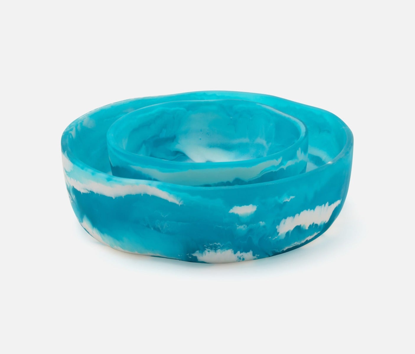 Swirling resin and irregular shapes give this generously proportioned serving bowl set a natural, laid-back vibe. Eye-catching and versatile, Beatrix brings unconventional beauty to the kitchen, dining room, or patio.