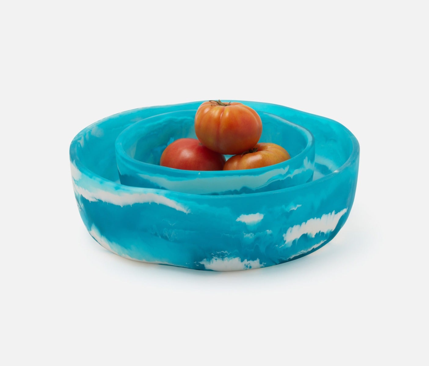 Swirling resin and irregular shapes give this generously proportioned serving bowl set a natural, laid-back vibe. Eye-catching and versatile, Beatrix brings unconventional beauty to the kitchen, dining room, or patio.