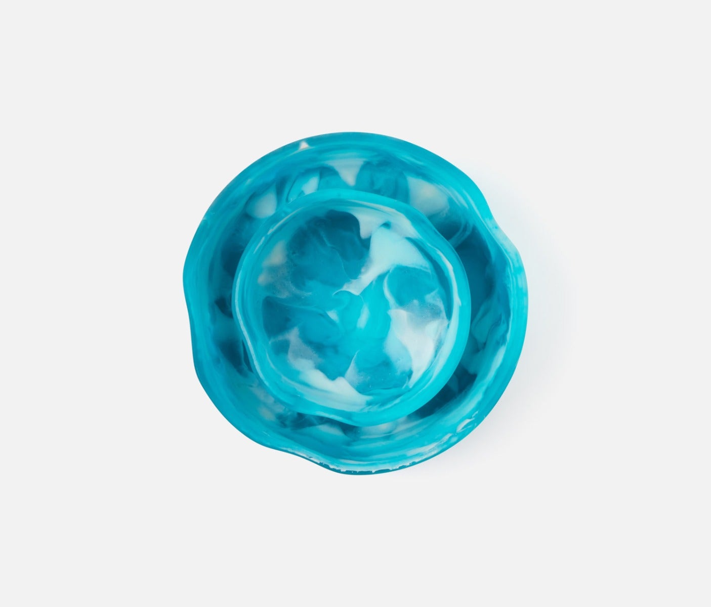 Swirling resin and irregular shapes give this generously proportioned serving bowl set a natural, laid-back vibe. Eye-catching and versatile, Beatrix brings unconventional beauty to the kitchen, dining room, or patio.