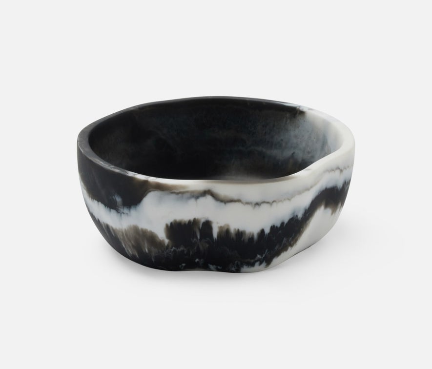 Swirling resin and irregular shapes give this generously proportioned serving bowl set a natural, laid-back vibe. Eye-catching and versatile, Beatrix brings unconventional beauty to the kitchen, dining room, or patio.