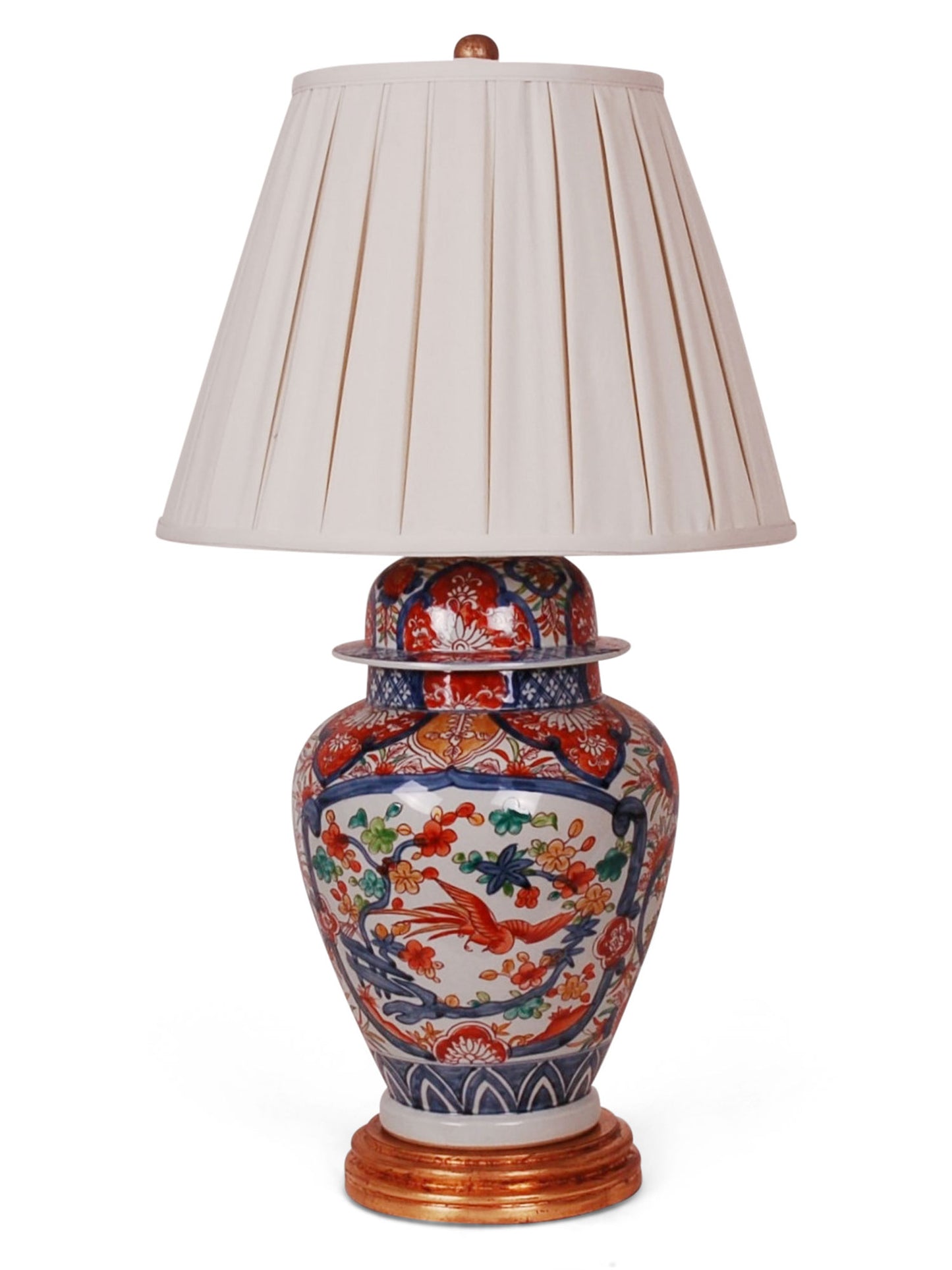 Reproduction porcelain jar with imari design. Comes on a hand-gilded gold leaf base with box pleated shade in cream.