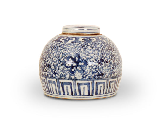 Reproduction porcelain jar with blue and white floral design and a greek key trim. Made with foot-stomped clay.