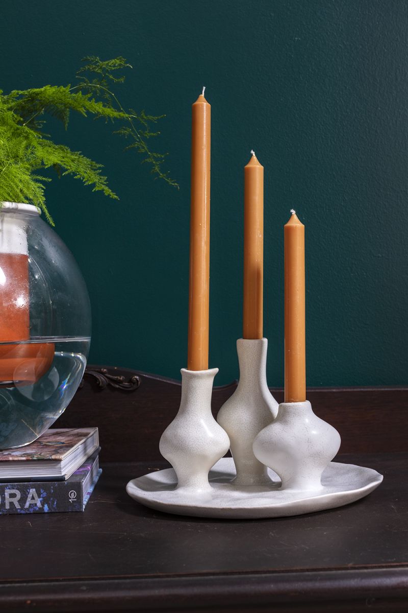 A budvase trio finished in glazed white ceramic on an attached white tray.