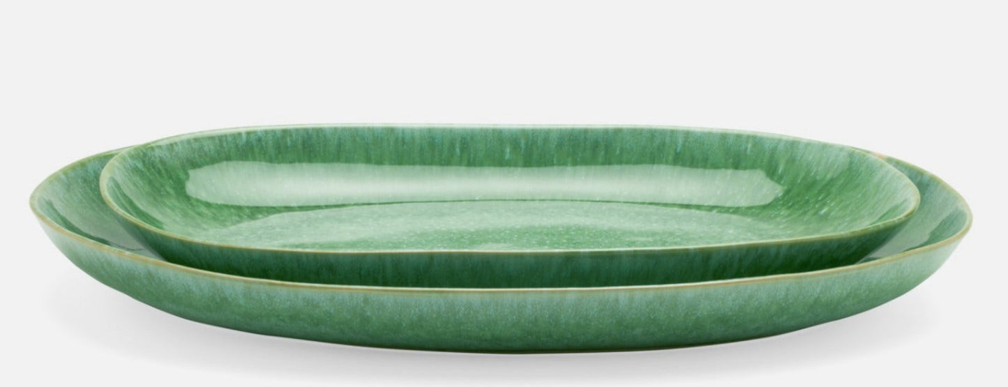 Reactive emerald glaze, speckled in white is made from stoneware. Comes as a set of two trays.