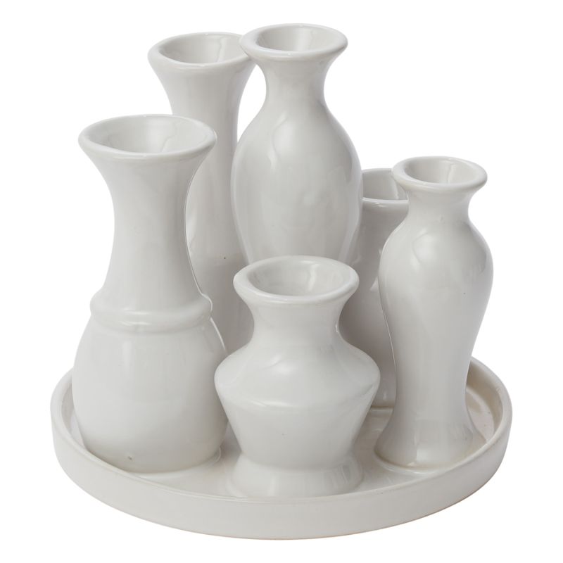 Round ceramic trays with groupings of attached budvases