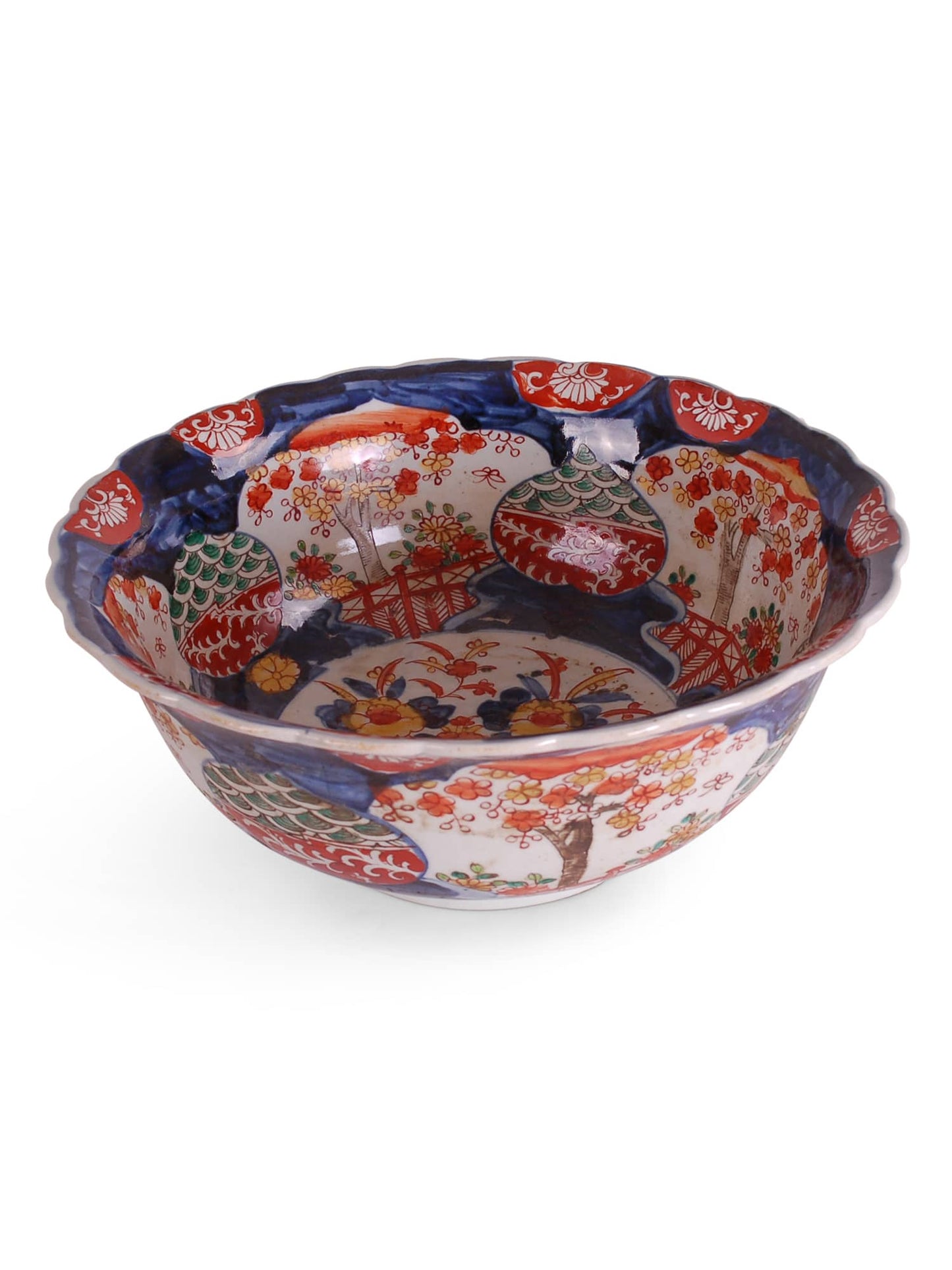 Reproduction porcelain bowl with Imari design and scalloped edges featuring sage, rust red, coral and shades of blue.