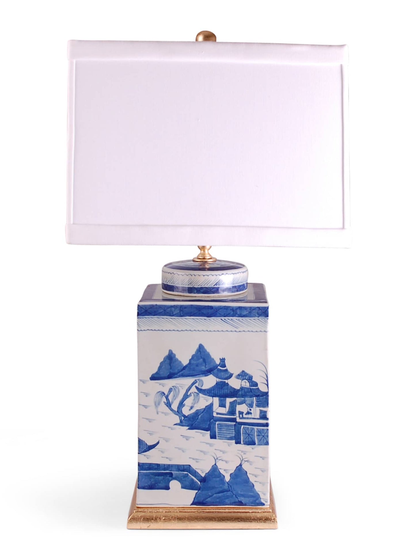 porcelain square tea caddie lamp with blue and white Canton design. Comes on a hand-gilded gold leaf base with 0.5″ trim square drum shade in white.