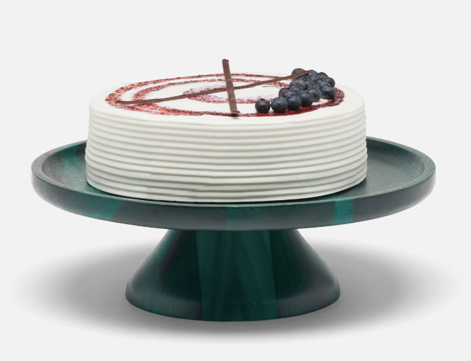 The Bryce cake stand is crafted from acacia wood and finished in a striking emerald finish