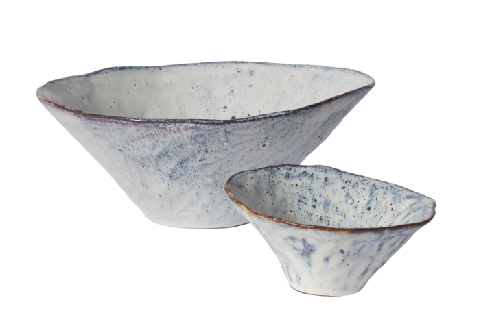 Vessel has a wavy rim and irregular sanded glaze with purple, iridescent and blue tones.