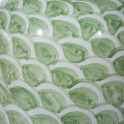 Green jar with a fish scale pattern.