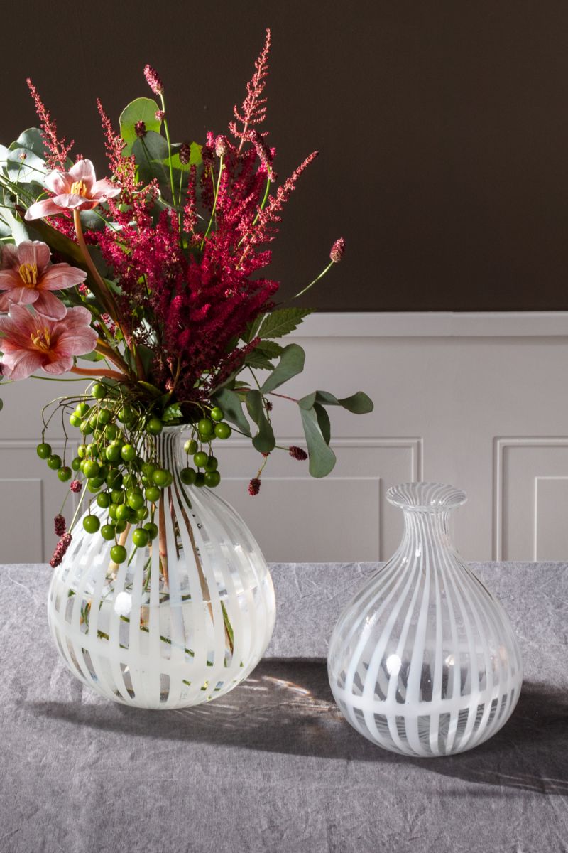 Clear and white striped bud vases in two sizes.