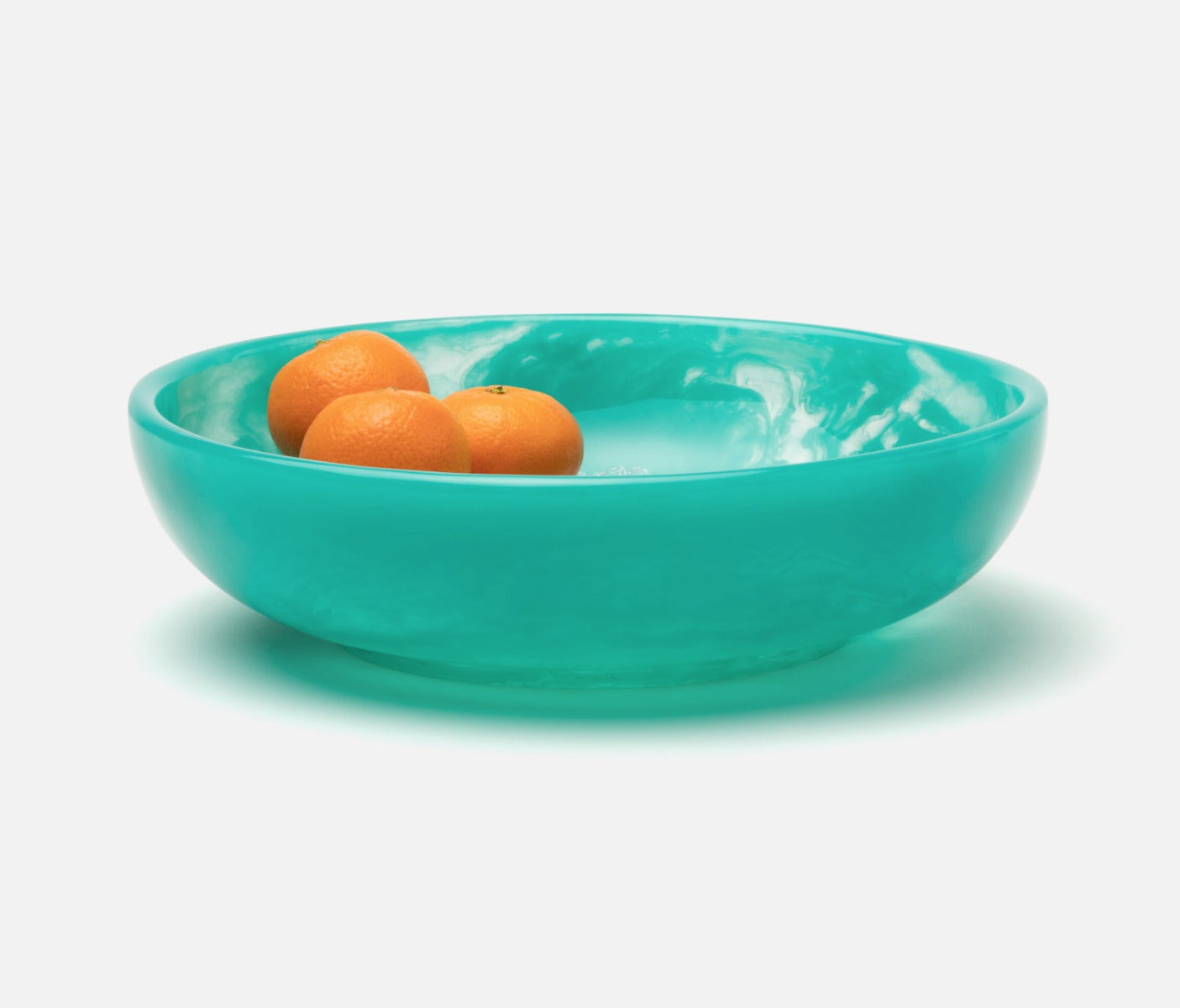 Turquoise serving bowl  made of resin.