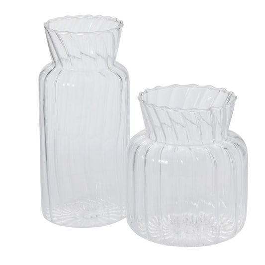 Ribbed Vase features optical detailing that creates attractive curves around a flared opening. Available in two sizes.