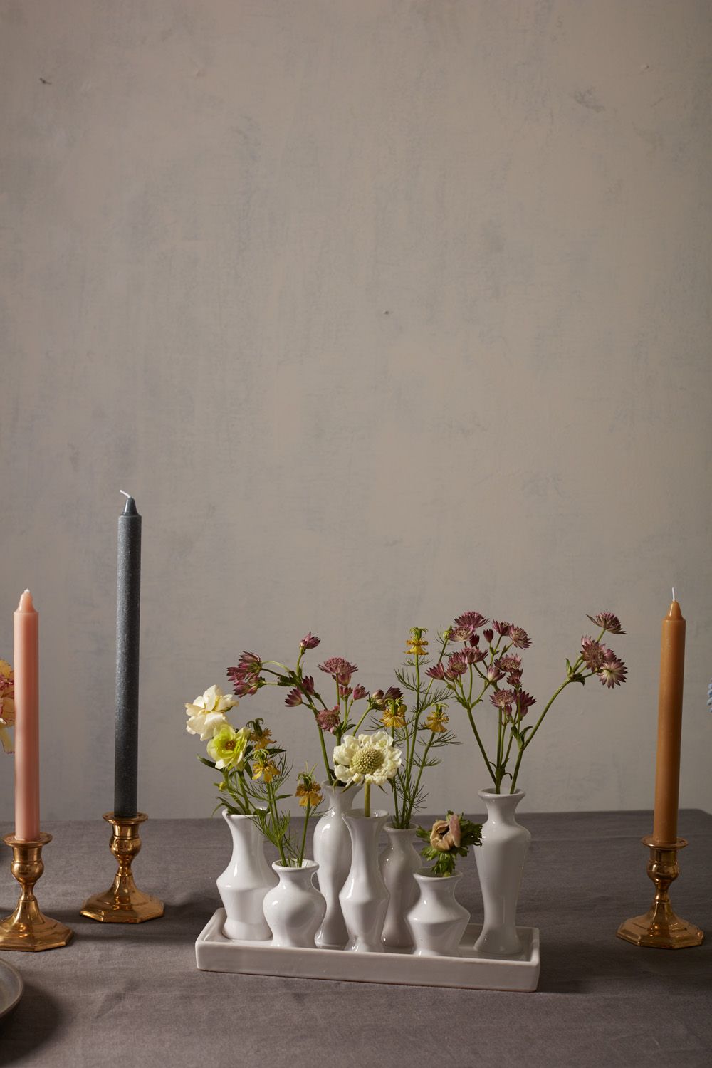 Ceramic trays with groupings of attached budvases.