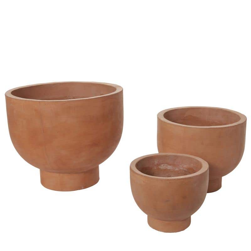 Three sizes of compote terracotta planters in modern shapes.