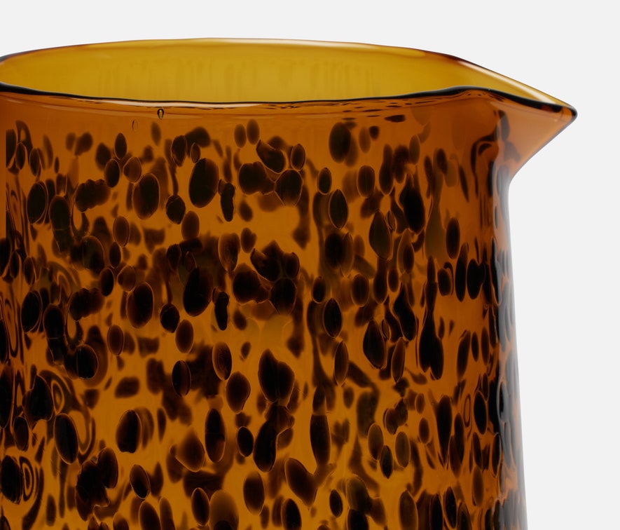 Pitcher made from hand-blown glass in a tortoise shell finish..