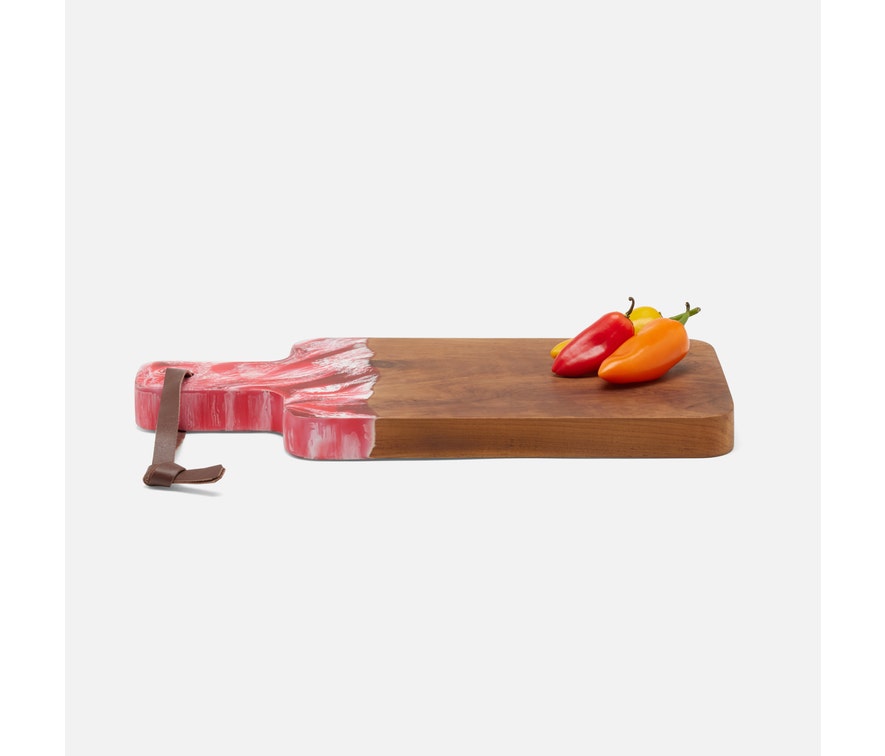 Teak board and resin handle are combined to create a one of a kind serving board. The handle is two-toned and hand-dipped in a berry color. Finished with a leather strap.