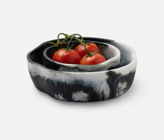 Swirling resin and irregular shapes give this generously proportioned serving bowl set a natural, laid-back vibe. Eye-catching and versatile, Beatrix brings unconventional beauty to the kitchen, dining room, or patio.