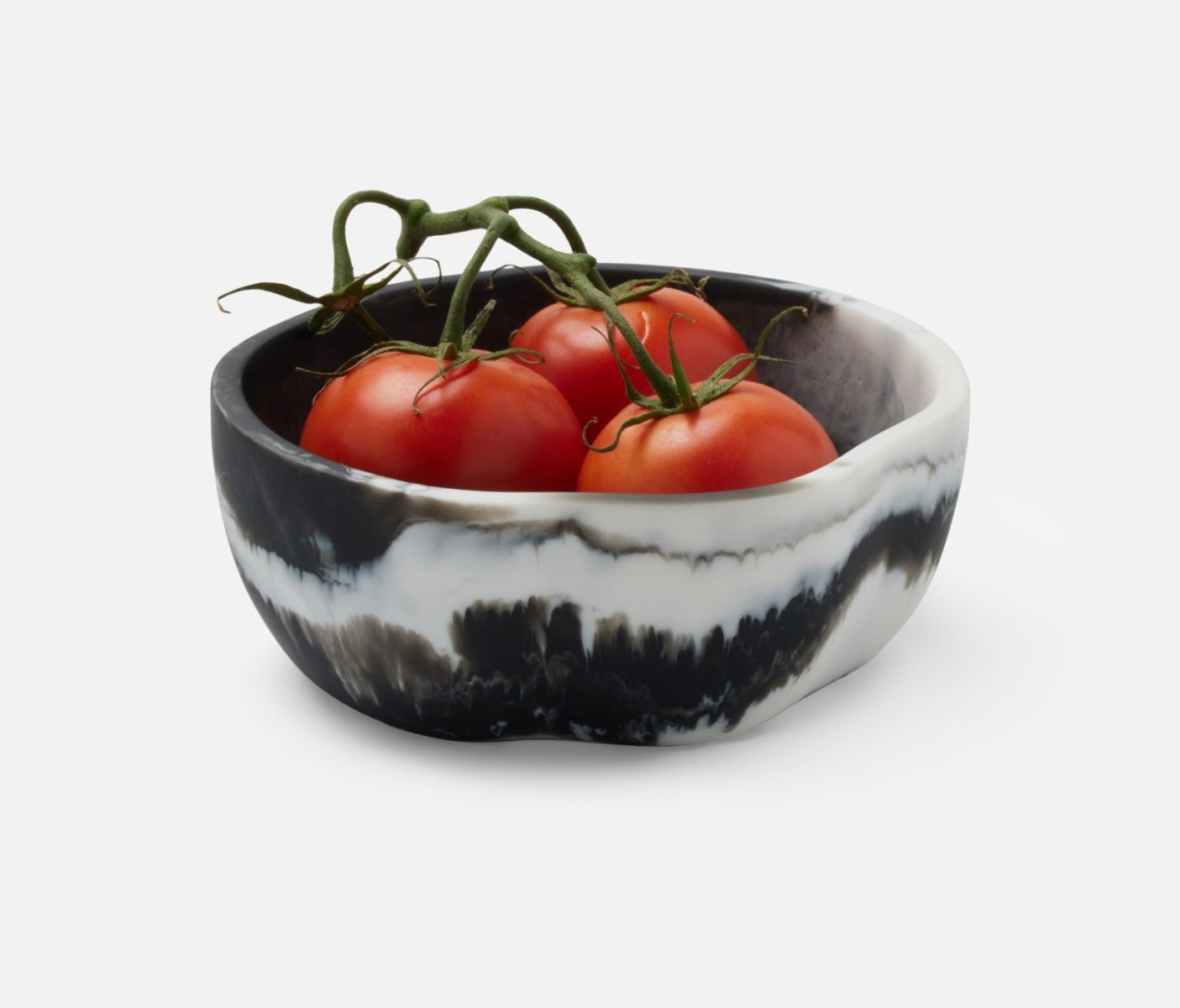 Swirling resin and irregular shapes give this generously proportioned serving bowl set a natural, laid-back vibe. Eye-catching and versatile, Beatrix brings unconventional beauty to the kitchen, dining room, or patio.