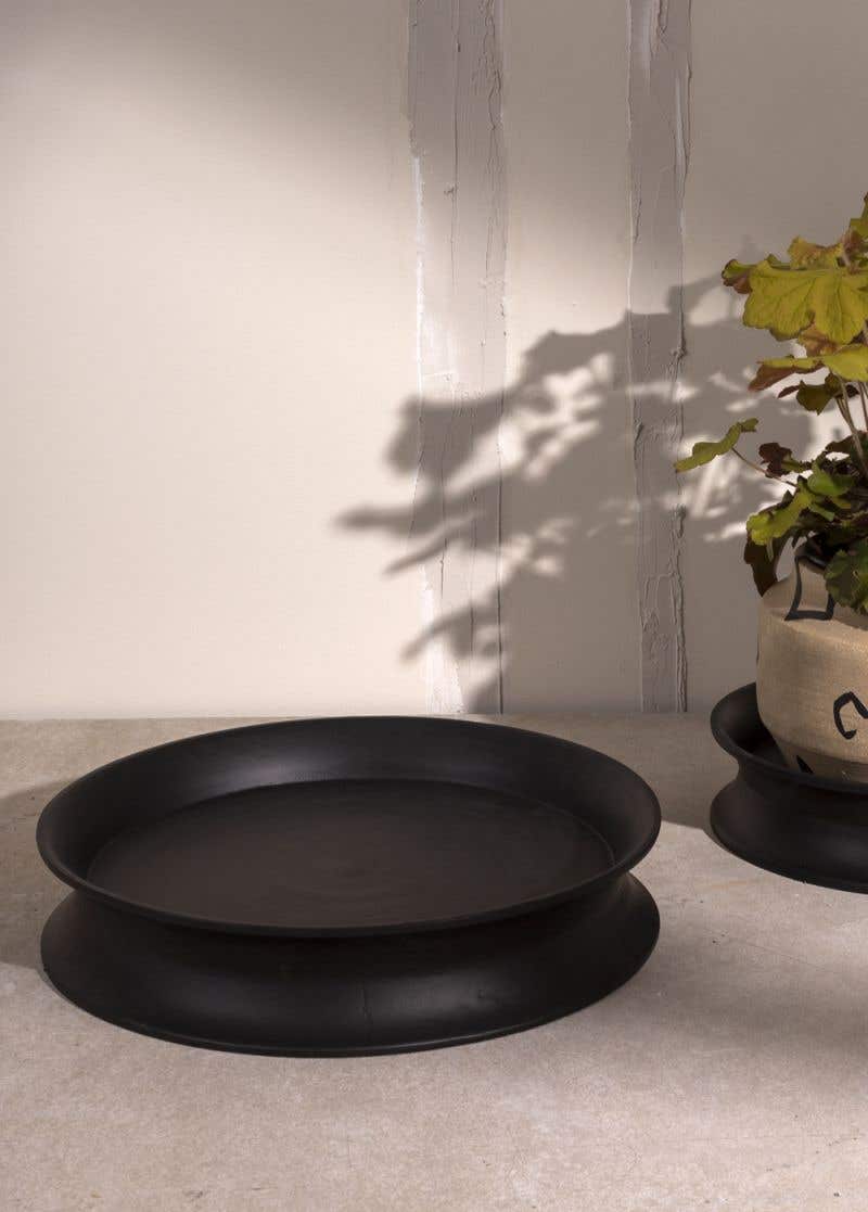 Modern black tray that goes with everything. Use it as a riser for multiple candles, a plant stand, or knick-knacks