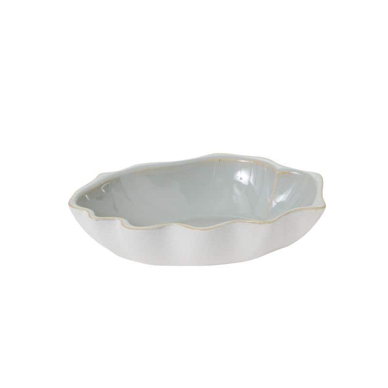 Clamshell-like rim our the ceramic bowl has a blue gloss glazed interior.