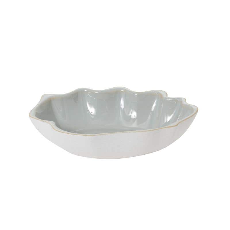 Clamshell-like rim our the ceramic bowl has a blue gloss glazed interior.